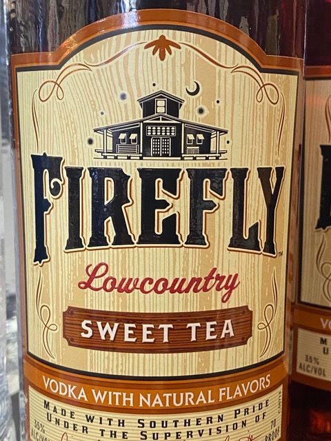 A bottle of firefly low country sweet tea vodka with natural flavors