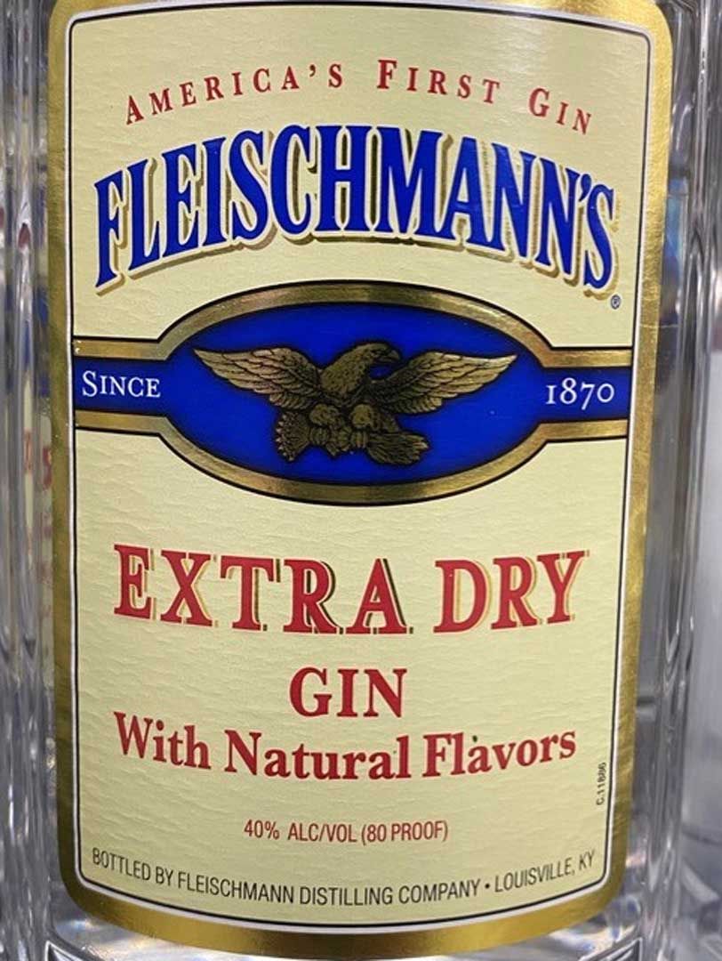 A bottle of fleischmann 's extra dry gin with natural flavors