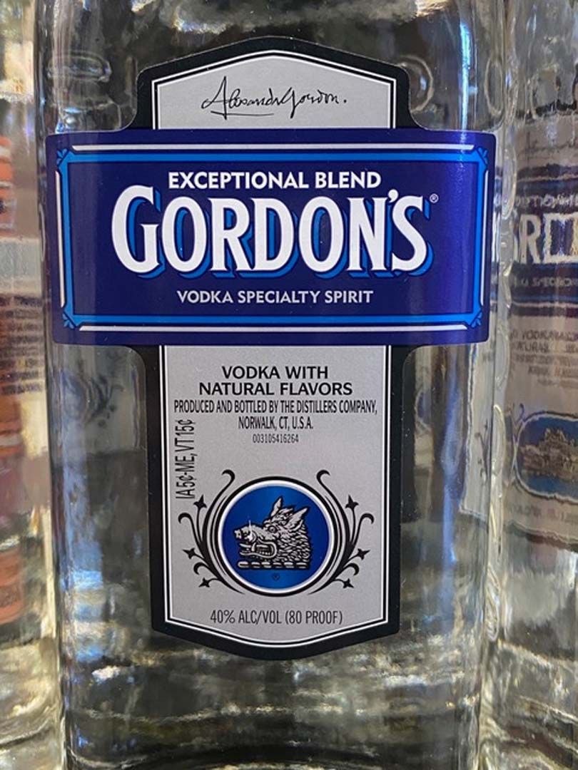 A close up of a bottle of gordon 's vodka with a blue label.
