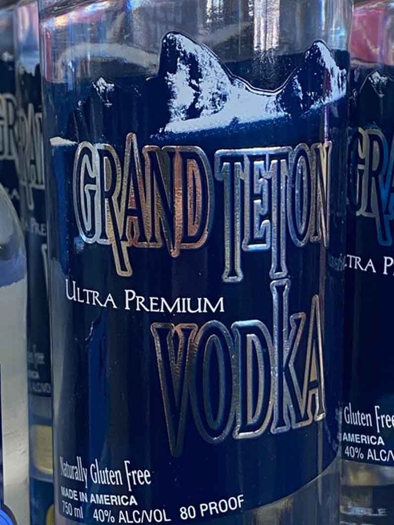 A close up of a bottle of grand teton vodka.