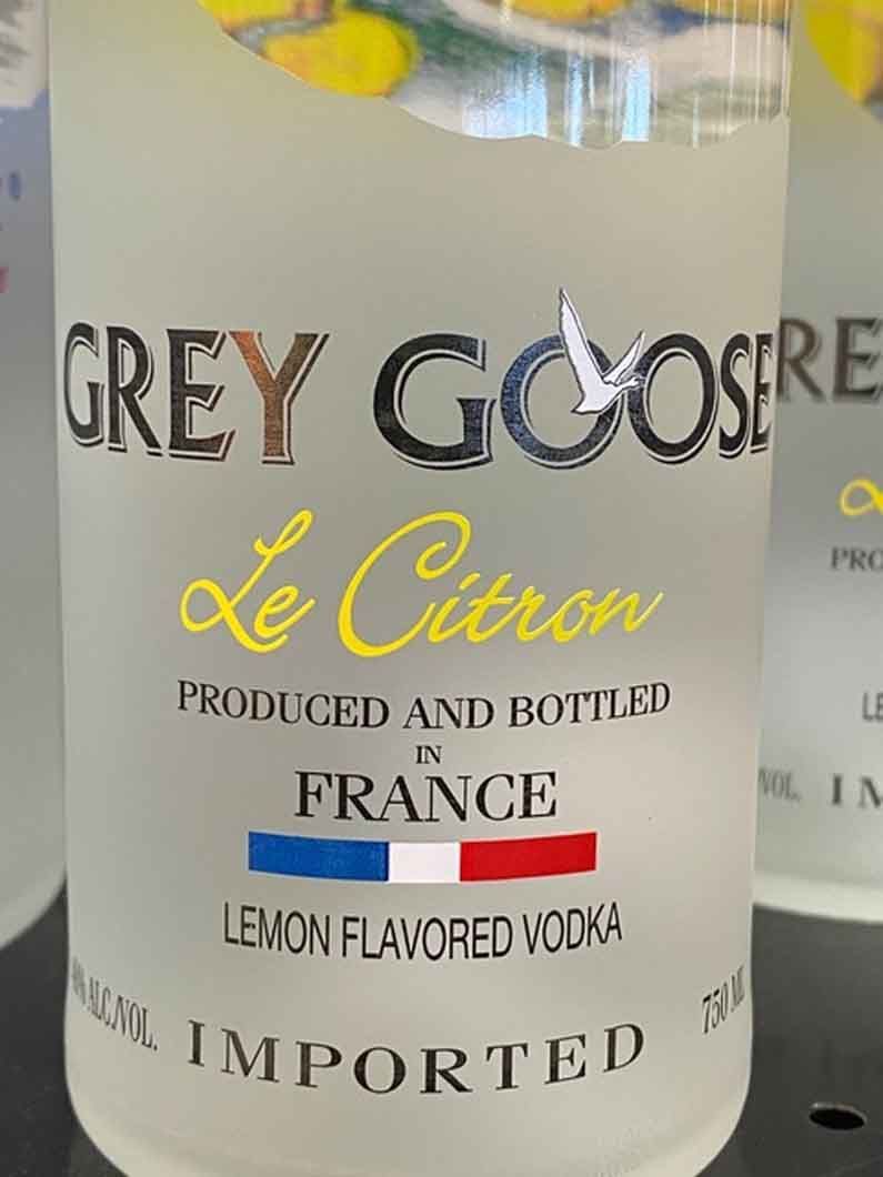 A bottle of grey goose le citron lemon flavored vodka
