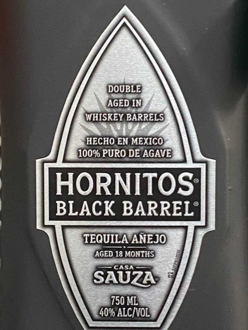 A bottle of hornitos black barrel tequila anejo