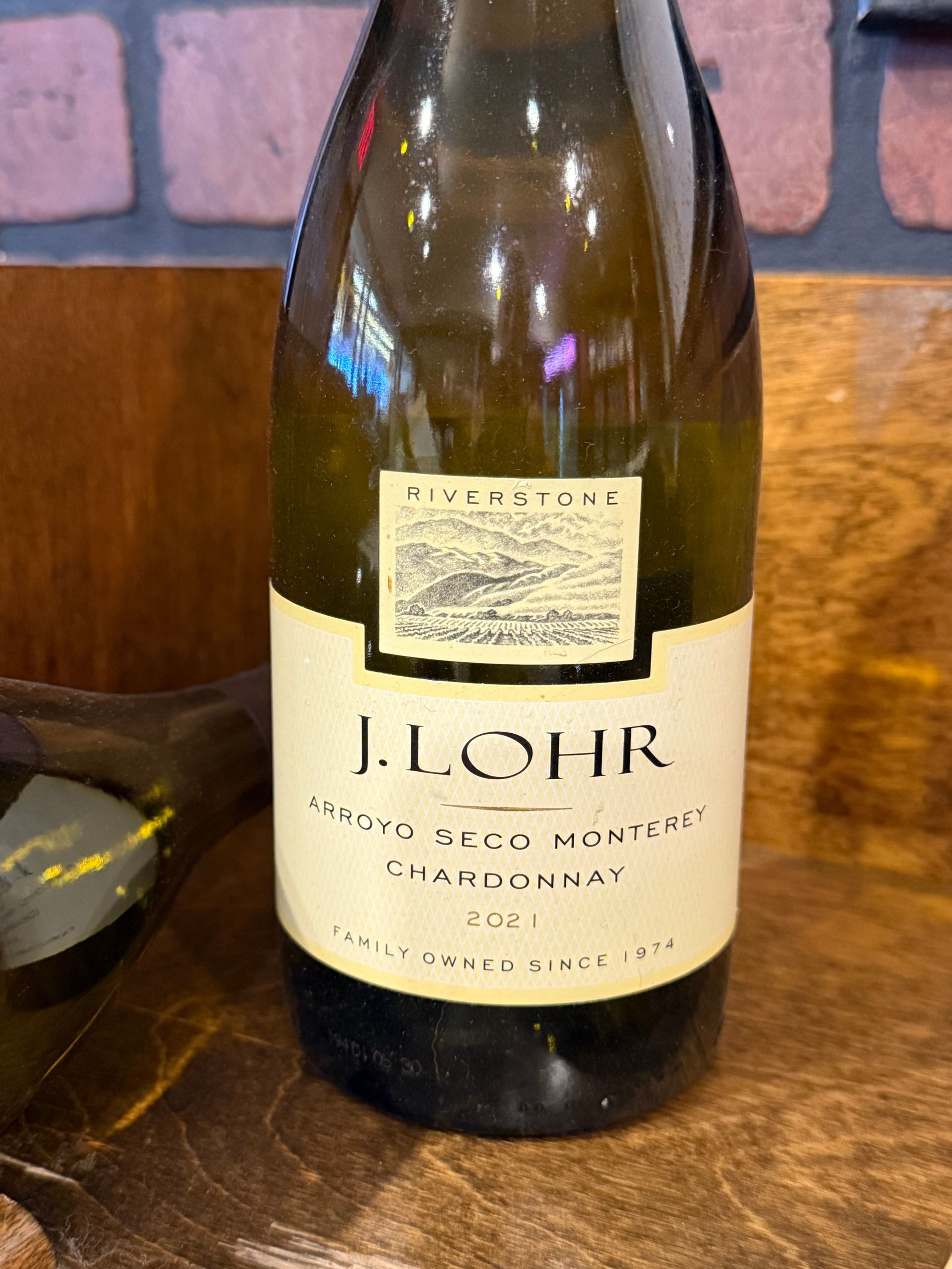 Bottle of J. Lohr Chardonnay wine, white label with black text, 2001 vintage.