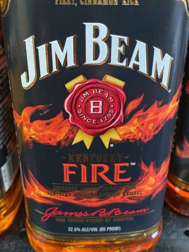 A bottle of jim beam fire kentucky whiskey