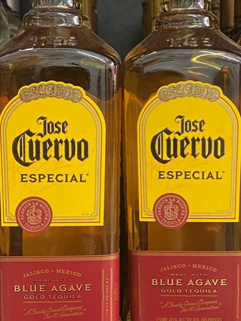 Two bottles of jose cuervo especial blue agave tequila