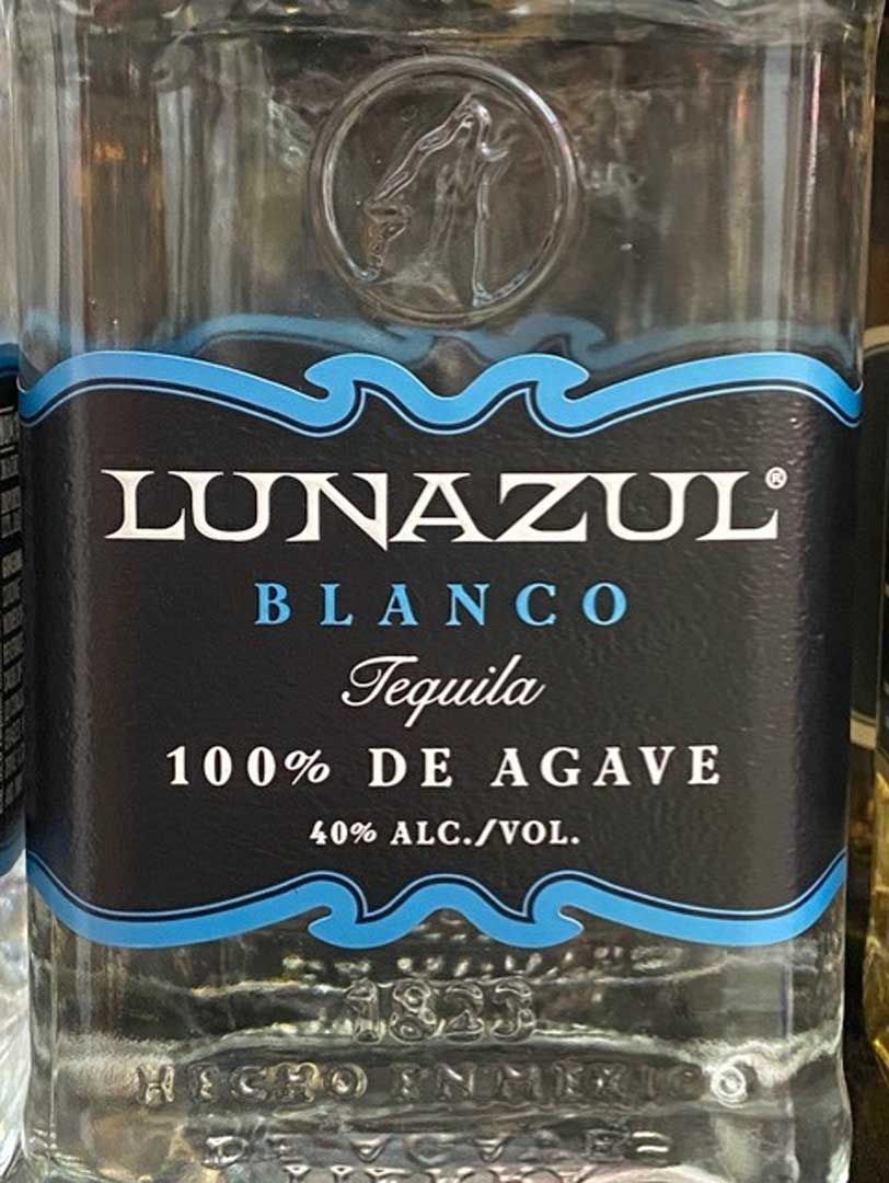 A close up of a bottle of lunazul blanco tequila