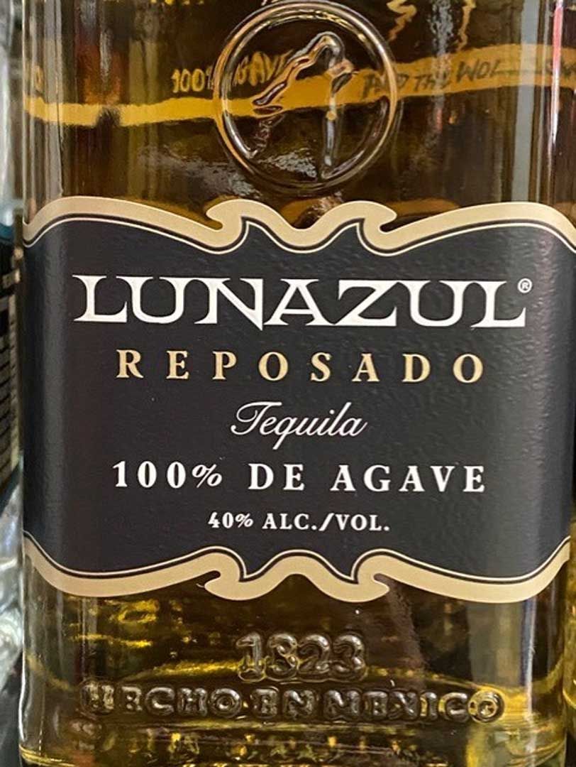 A bottle of lunazul reposado tequila 100 % de agave