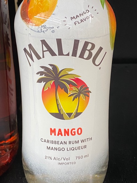 A bottle of malibu mango caribbean rum with mango liqueur