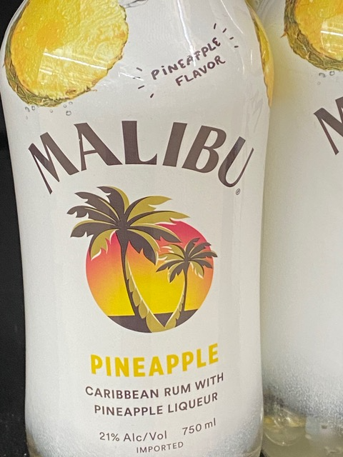 A bottle of malibu pineapple caribbean rum with pineapple liqueur