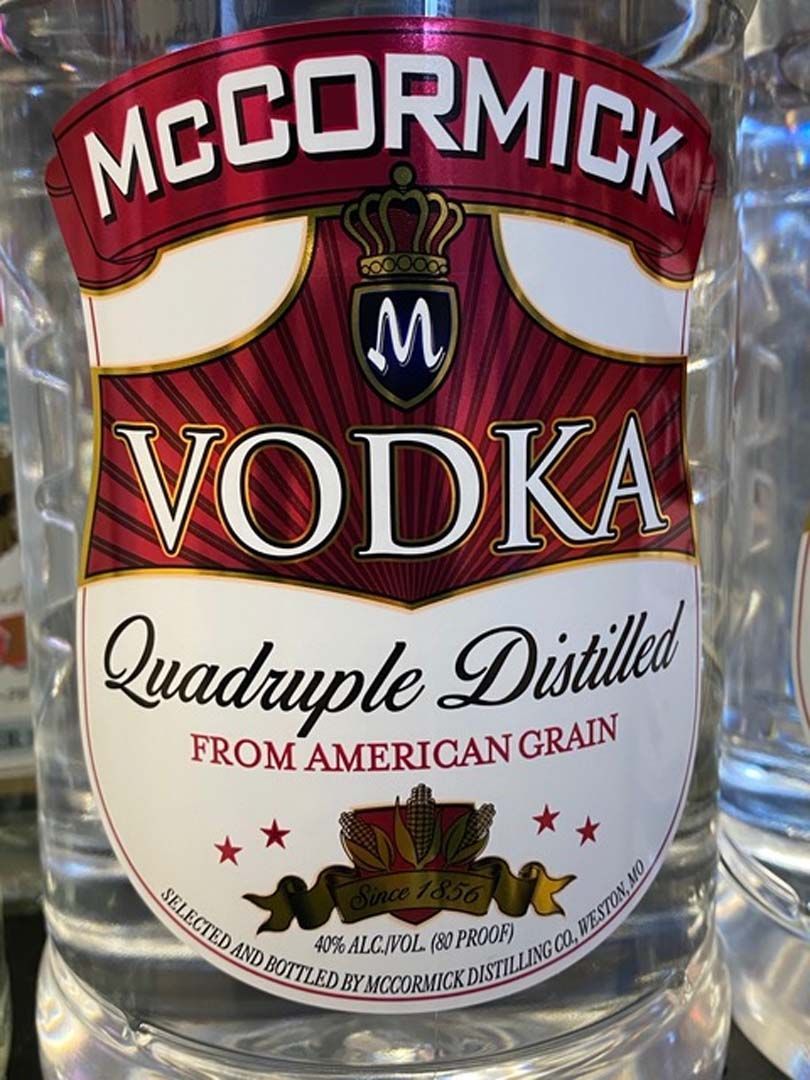 A bottle of mccormick vodka is sitting on a table.