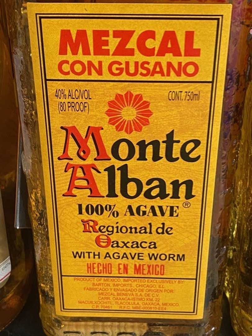 A bottle of mezcal con gusano from monte alban