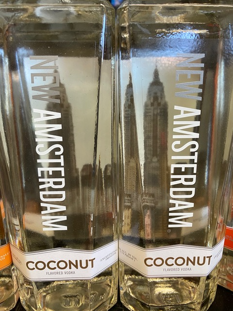 Two bottles of new amsterdam coconut vodka on a table