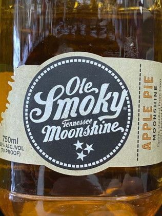 A close up of a bottle of ole smoky tennessee moonshine apple pie