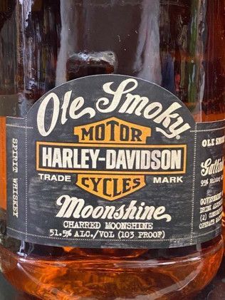 A close up of a bottle of harley davidson moonshine
