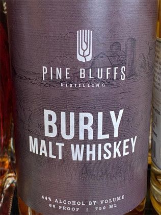 A bottle of pine bluffs burly malt whiskey