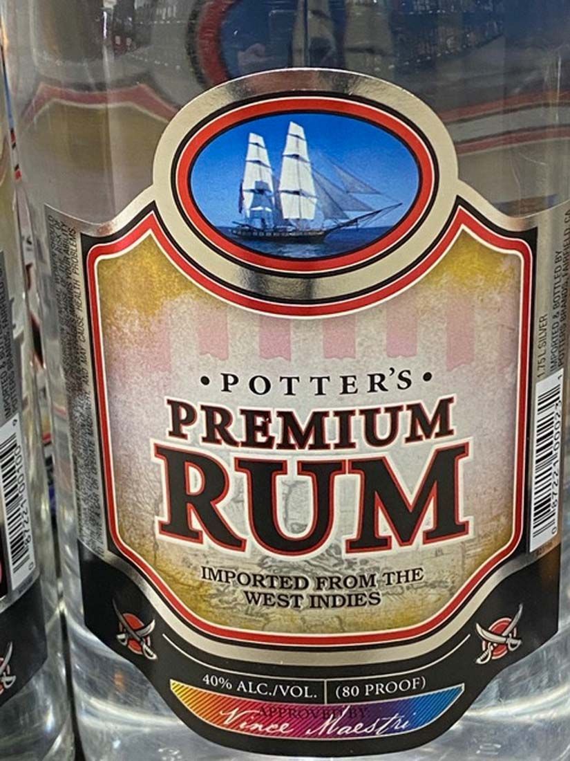A bottle of potter 's premium rum imported from the west indies