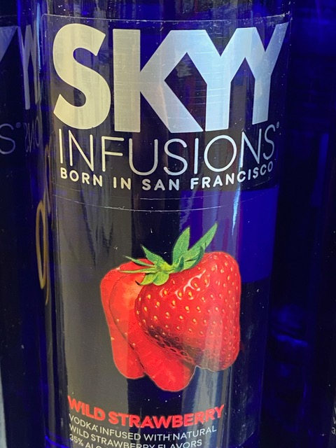 A bottle of skyy infusions wild strawberry vodka