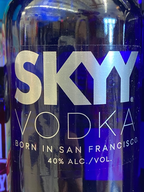 A close up of a bottle of skyy vodka