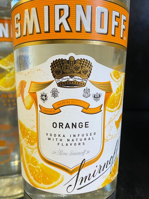 A bottle of smirnoff orange vodka infused with natural flavors
