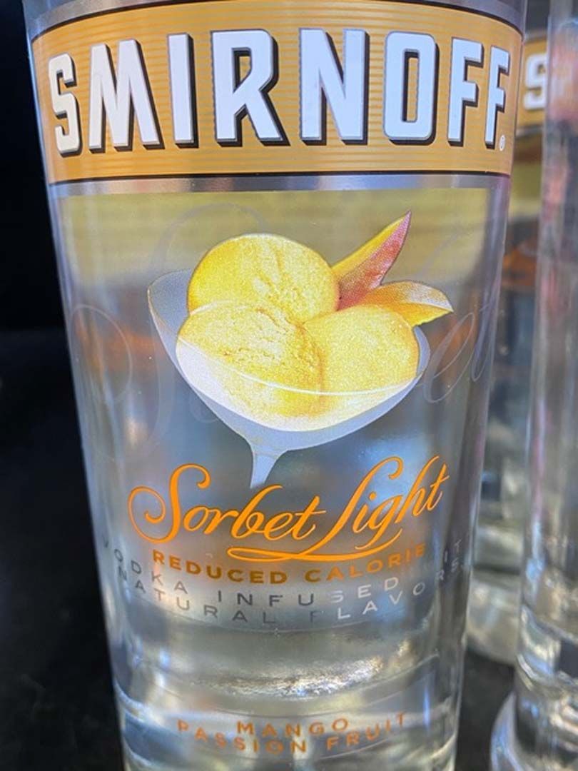 A close up of a smirnoff sorbet light glass