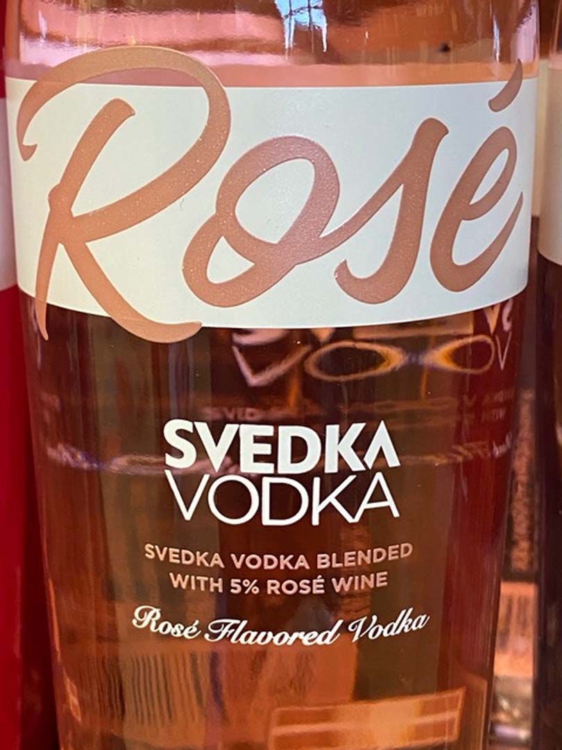 A close up of a bottle of svedka vodka rose