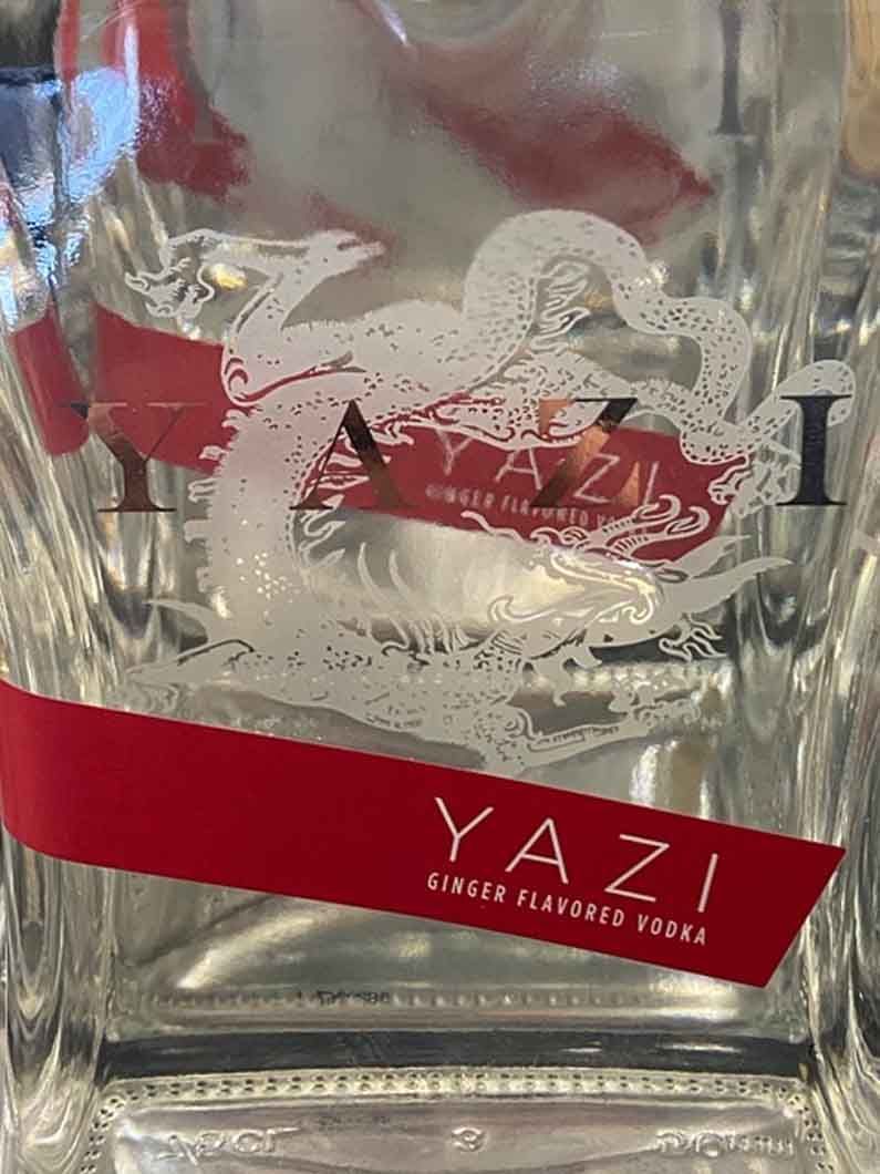 A bottle of yazi vodka with a dragon on the label.
