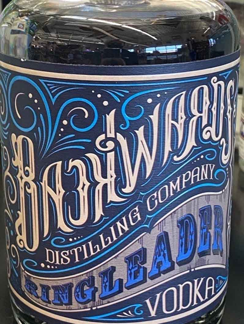 A bottle of single distilled vodka is sitting on a table.