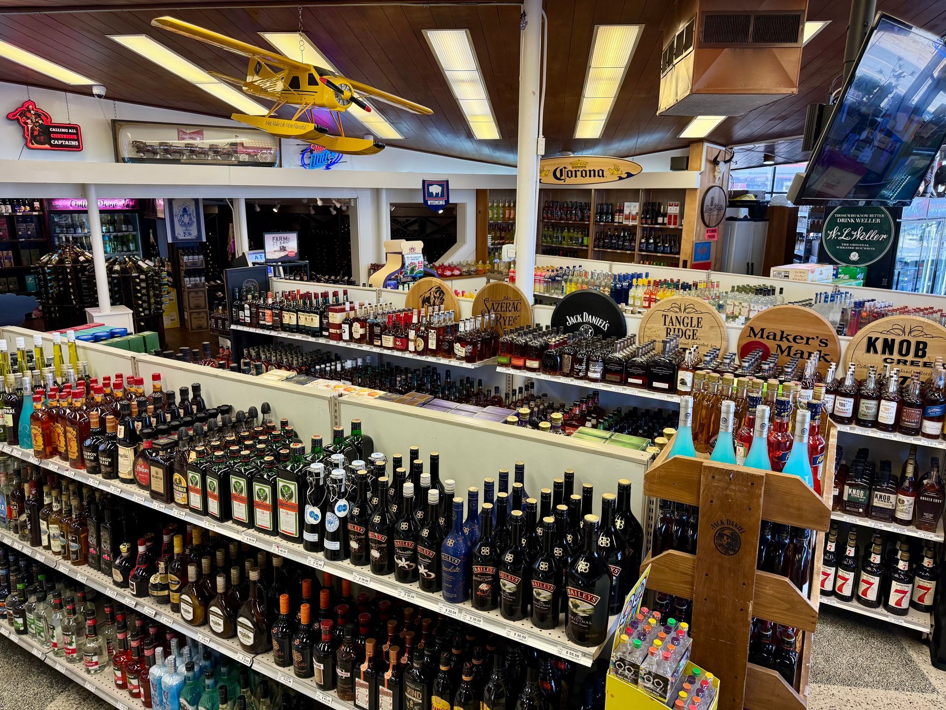 The inside of a liquor store filled with lots of bottles of beer.