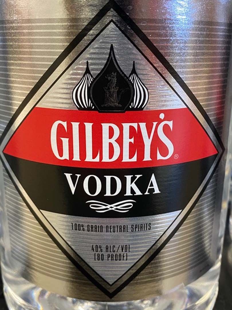 A close up of a bottle of gilbey 's vodka