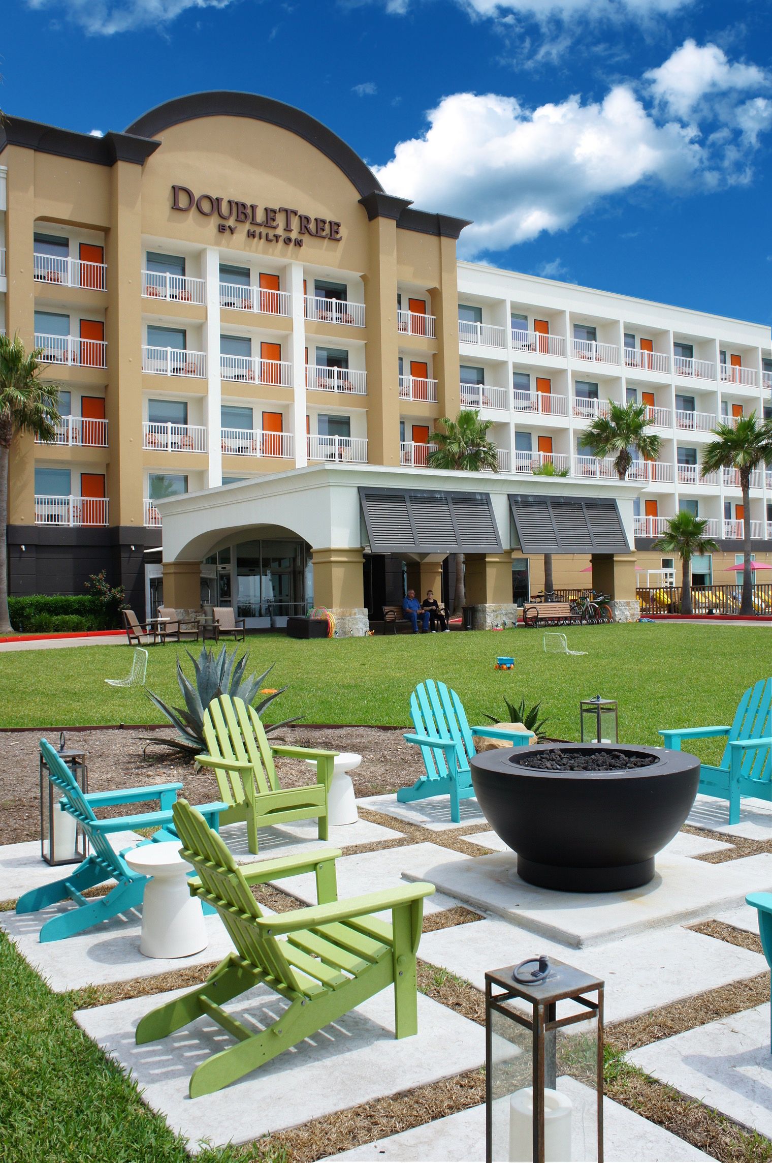 A longboard sign hangs above a bar full of liquor bottles