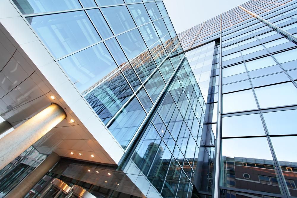 Looking Up at a Tall Building With a Lot of Windows — Cutting Edge Painting Contractors QLD in The Dawn, QLD