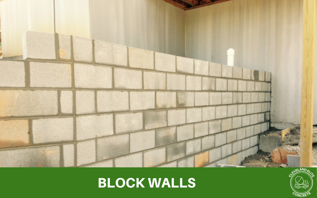 image of a new block wall, with text underneath that says block walls and the cleveland elite concrete logo