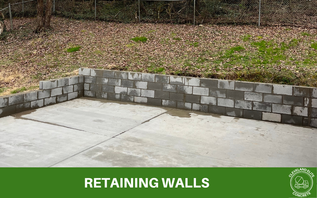 picture of a new backyard retaining wall with text underneath that says retaining walls and the cleveland elite concrete logo