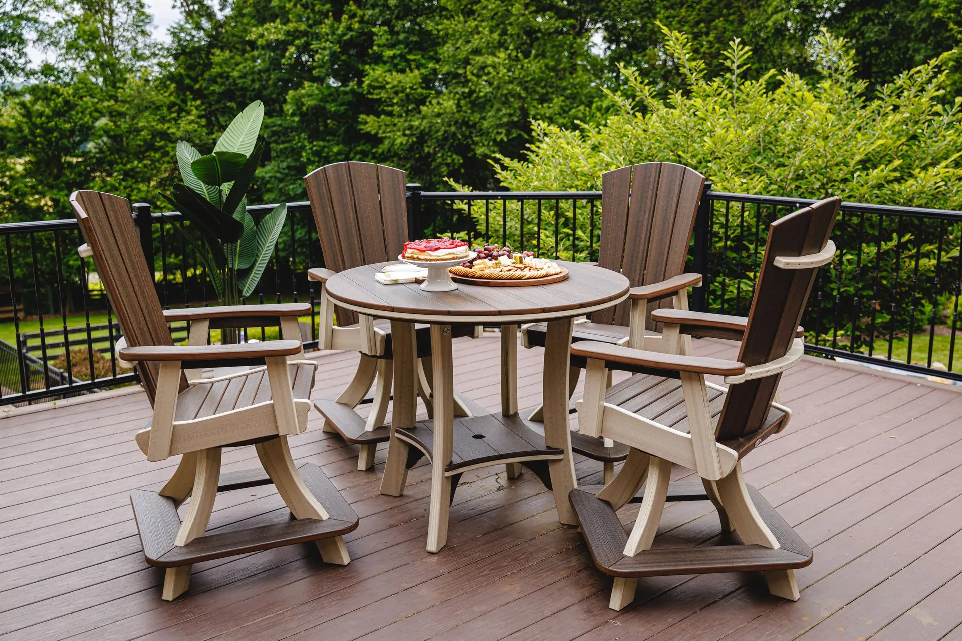 A group of colorful chairs are sitting around a fire pit.