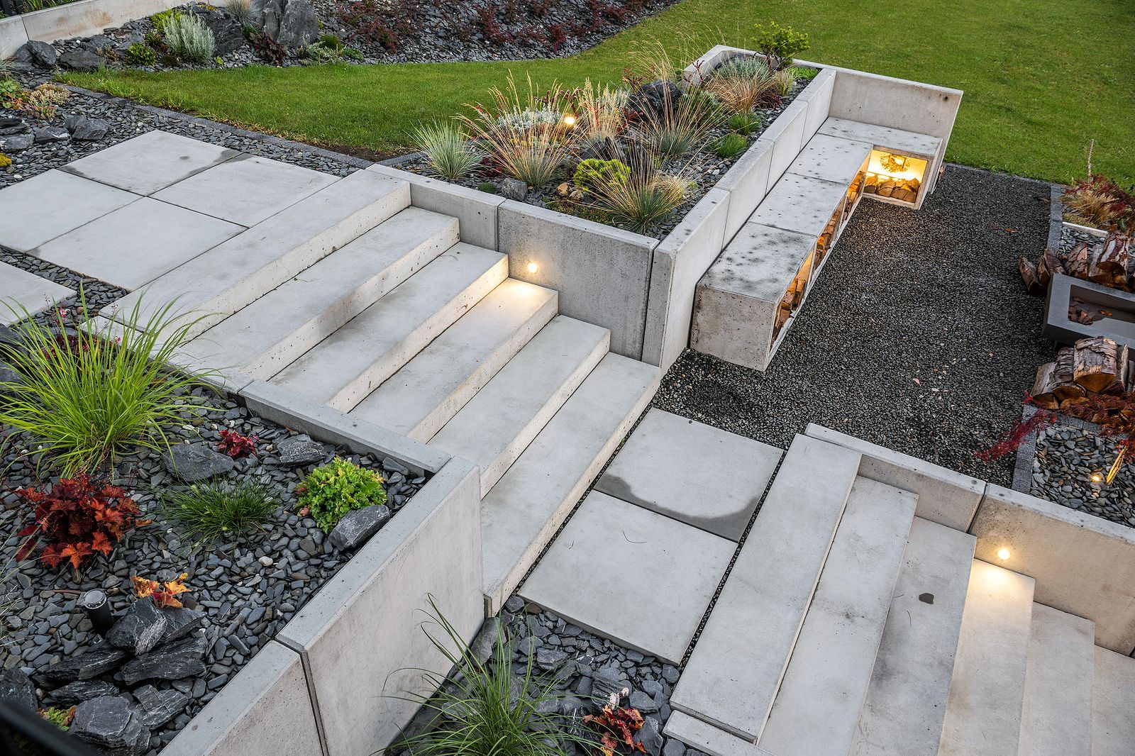 A set of stairs leading up to a lush green garden.