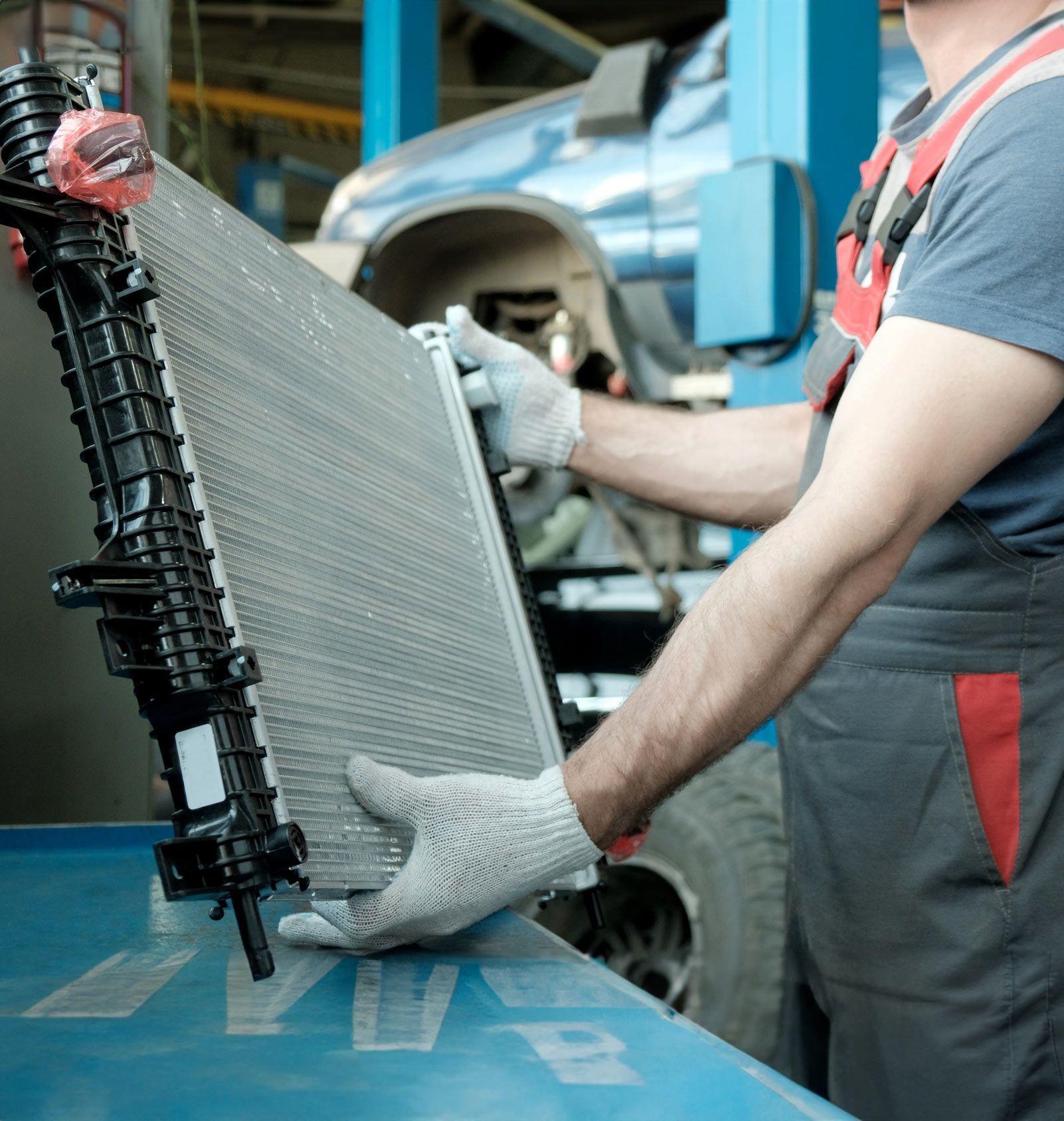 Holding Car Radiator — Los Angeles, CA — Rv Radiator & Muffler Inc Holding Car Radiator — Los Angeles, CA — Rv Radiator & Muffler Inc