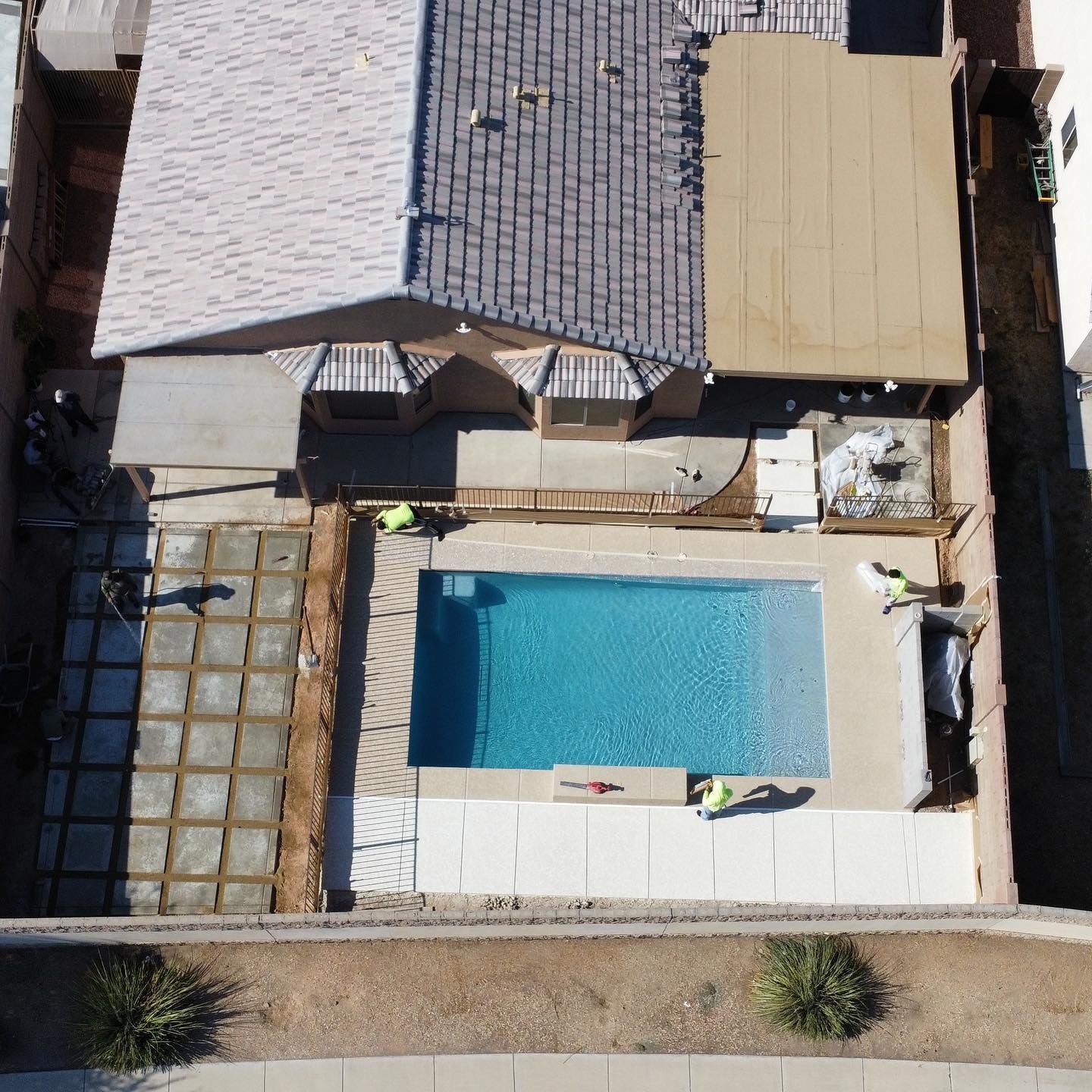 An aerial view of a house with a swimming pool