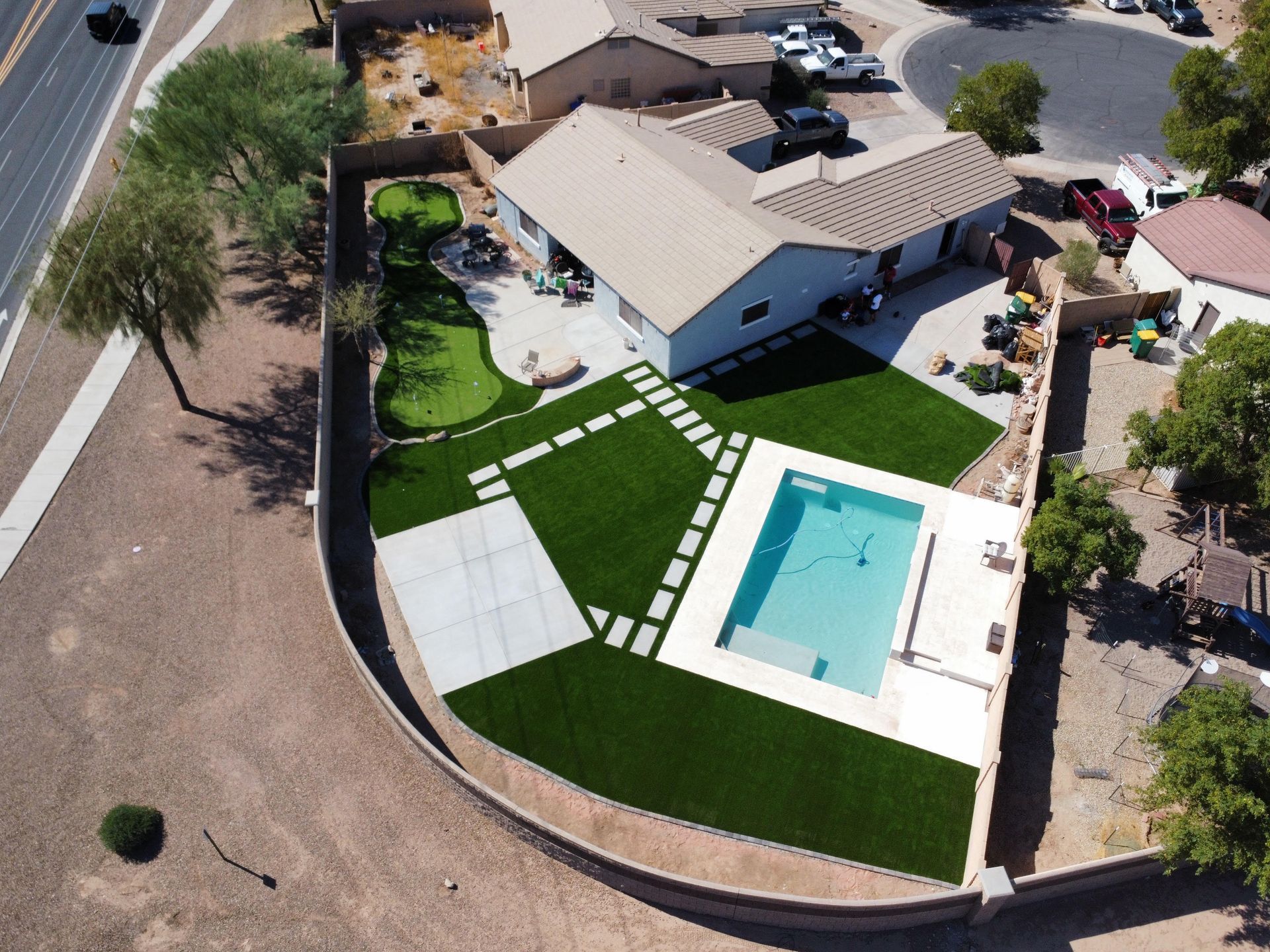 An aerial view of a house with a swimming pool