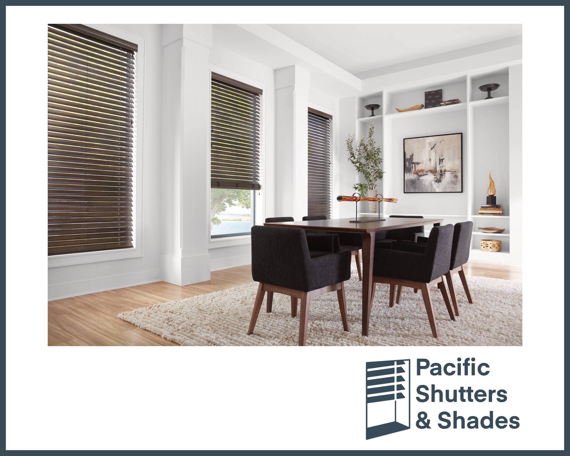 Dining room with brown shades, dark chairs, wooden table, white walls, and rug.