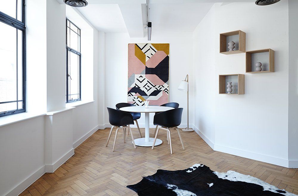A picture of a contemporary living room painted in white