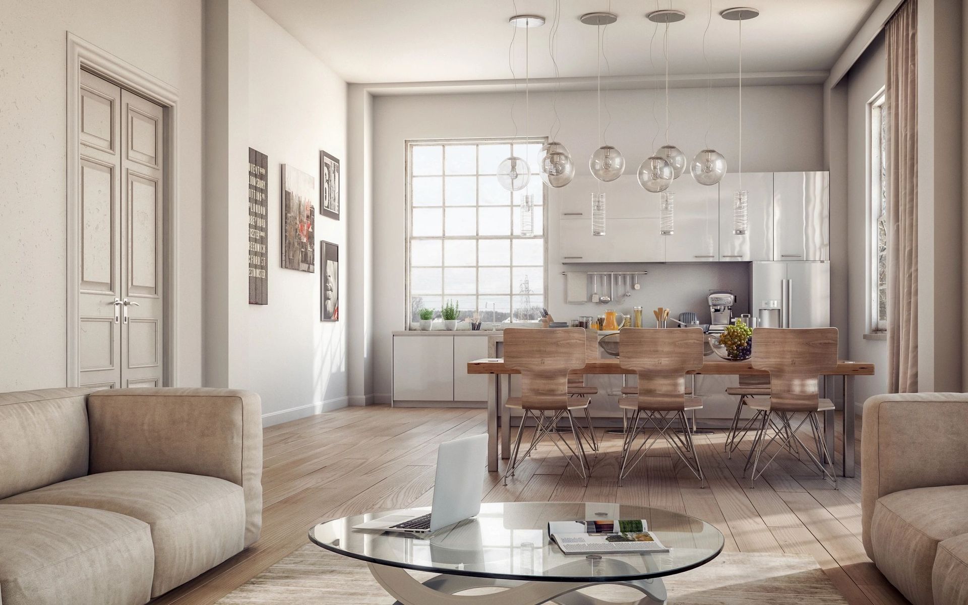 A living room with a couch and a table with a laptop on it.
