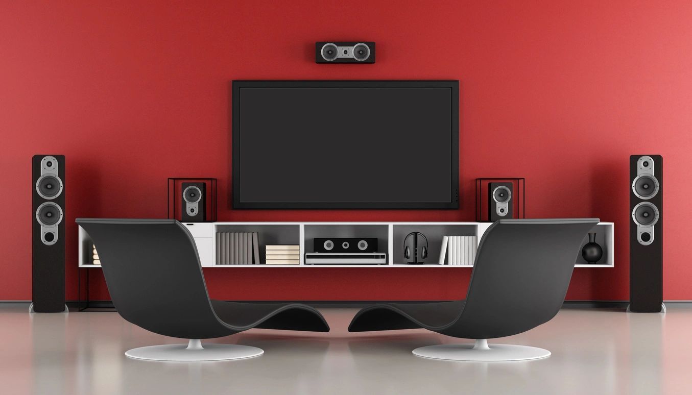 A living room with two chairs and a flat screen tv.