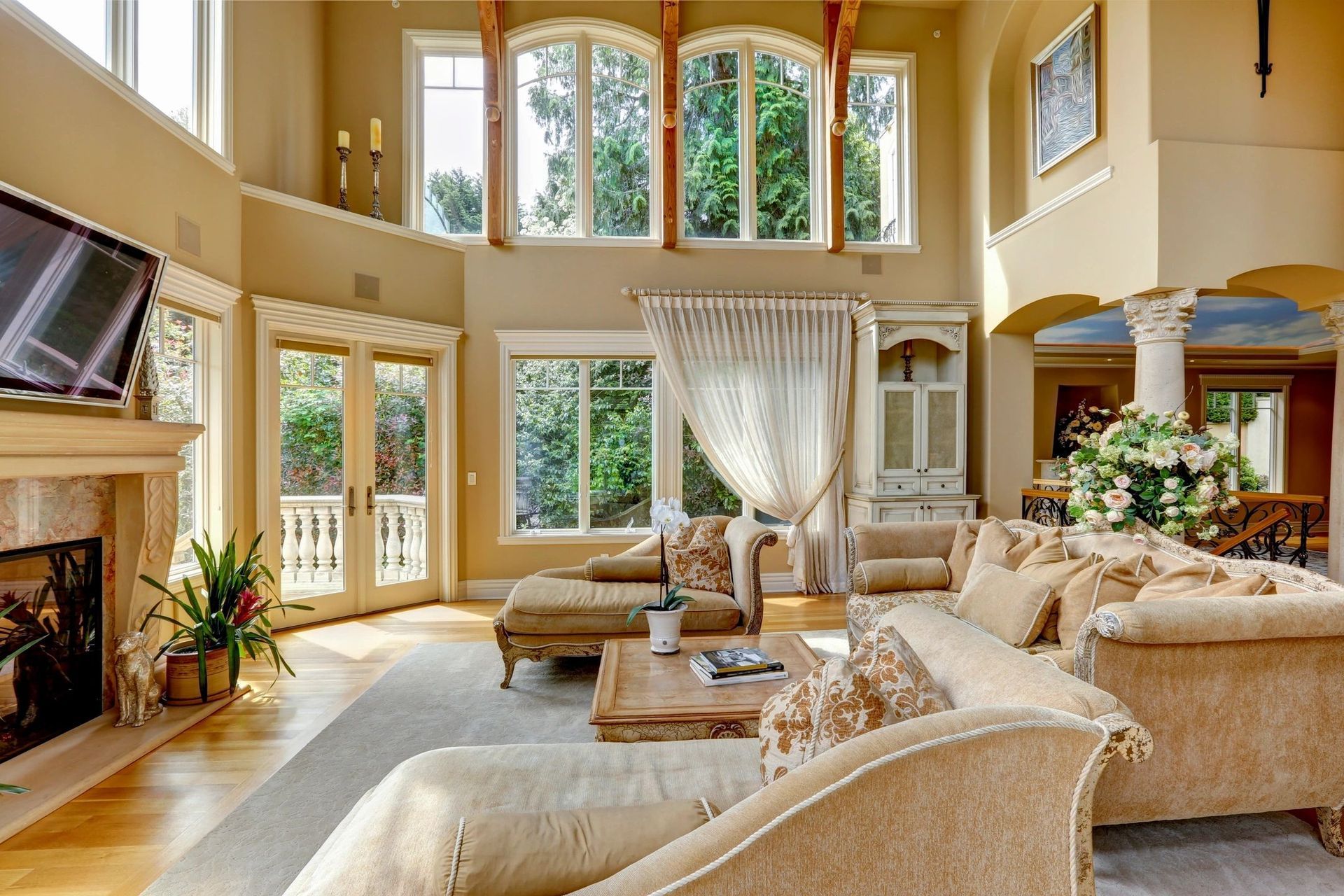 A living room with a lot of furniture and a fireplace
