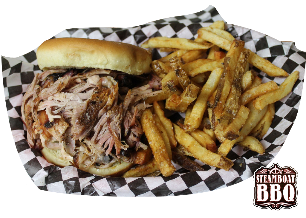 A pulled pork sandwich and french fries on a checkered paper