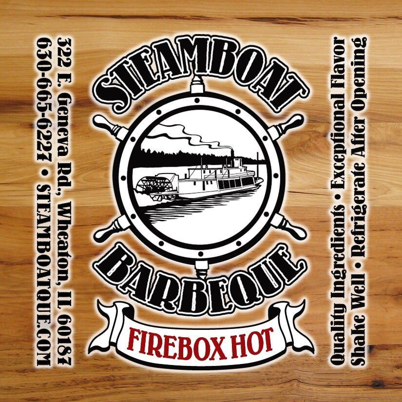 A logo for steamboat barbeque firebox hot on a wooden background