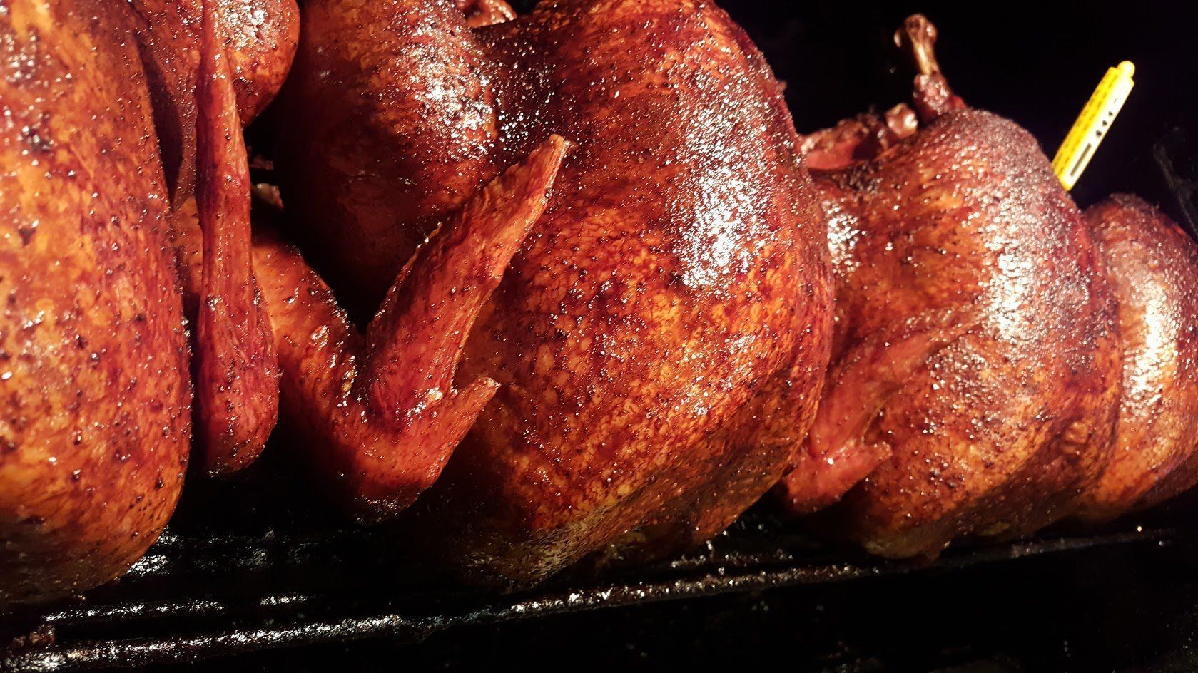 A close up of a bunch of meat on a grill