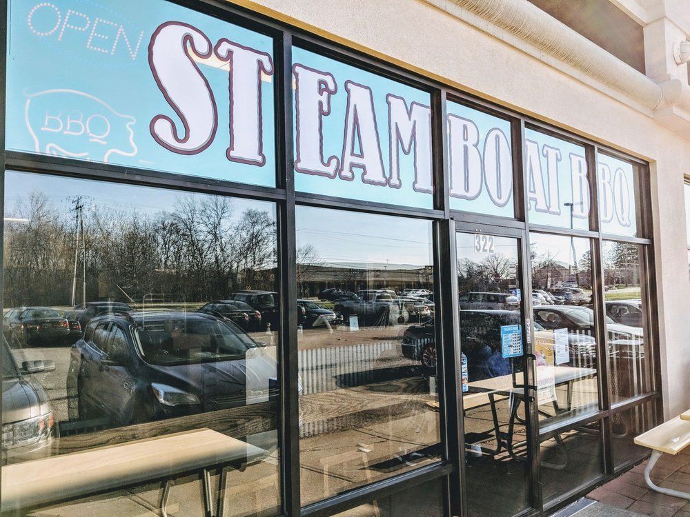 A store front with a sign that says steamboat on it.