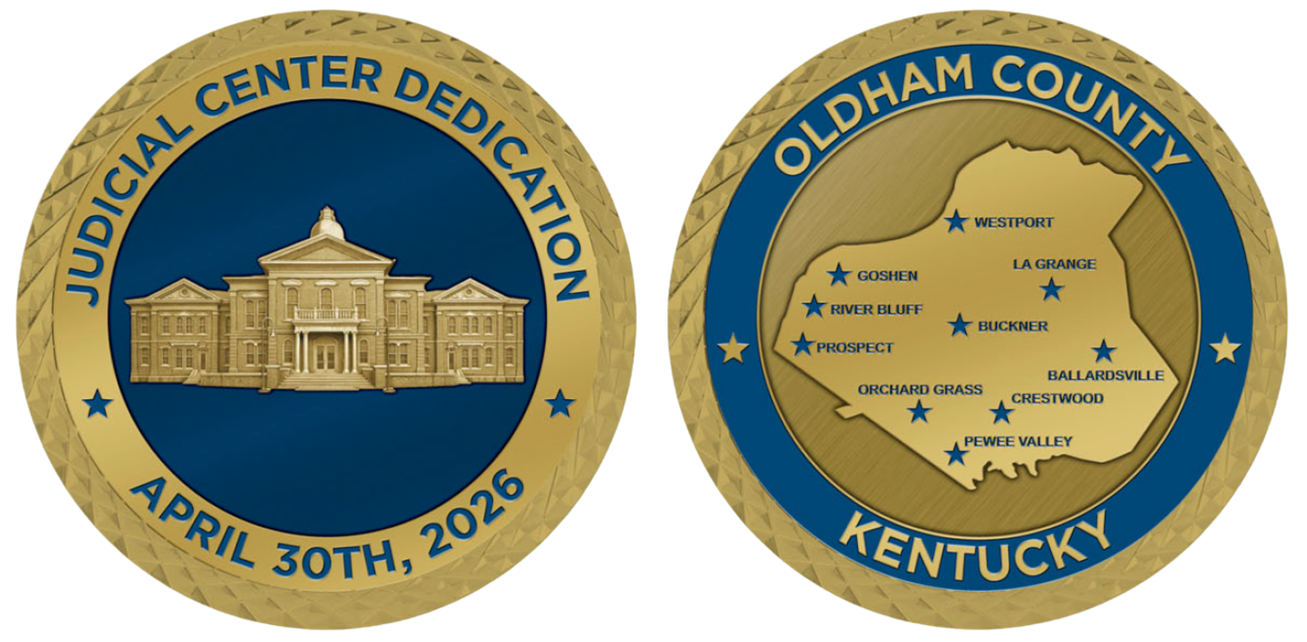 Two gold-and-blue seals: “Judicial Center Dedication April 30th, 2026” and “Oldham County Kentucky”