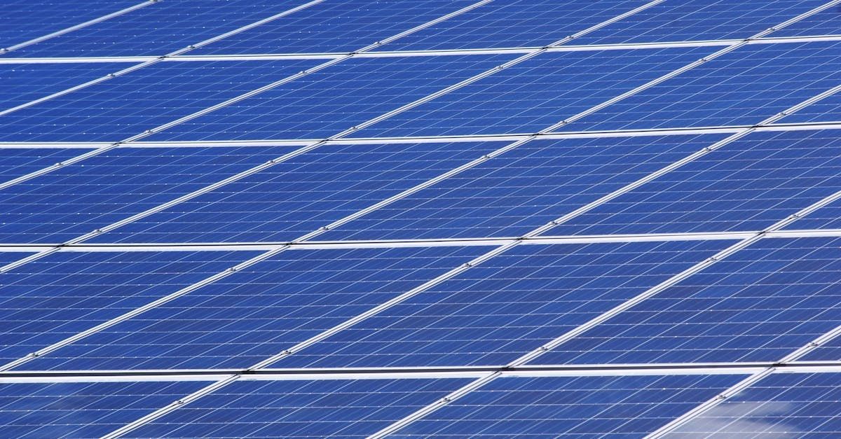 A close up of a row of blue solar panels