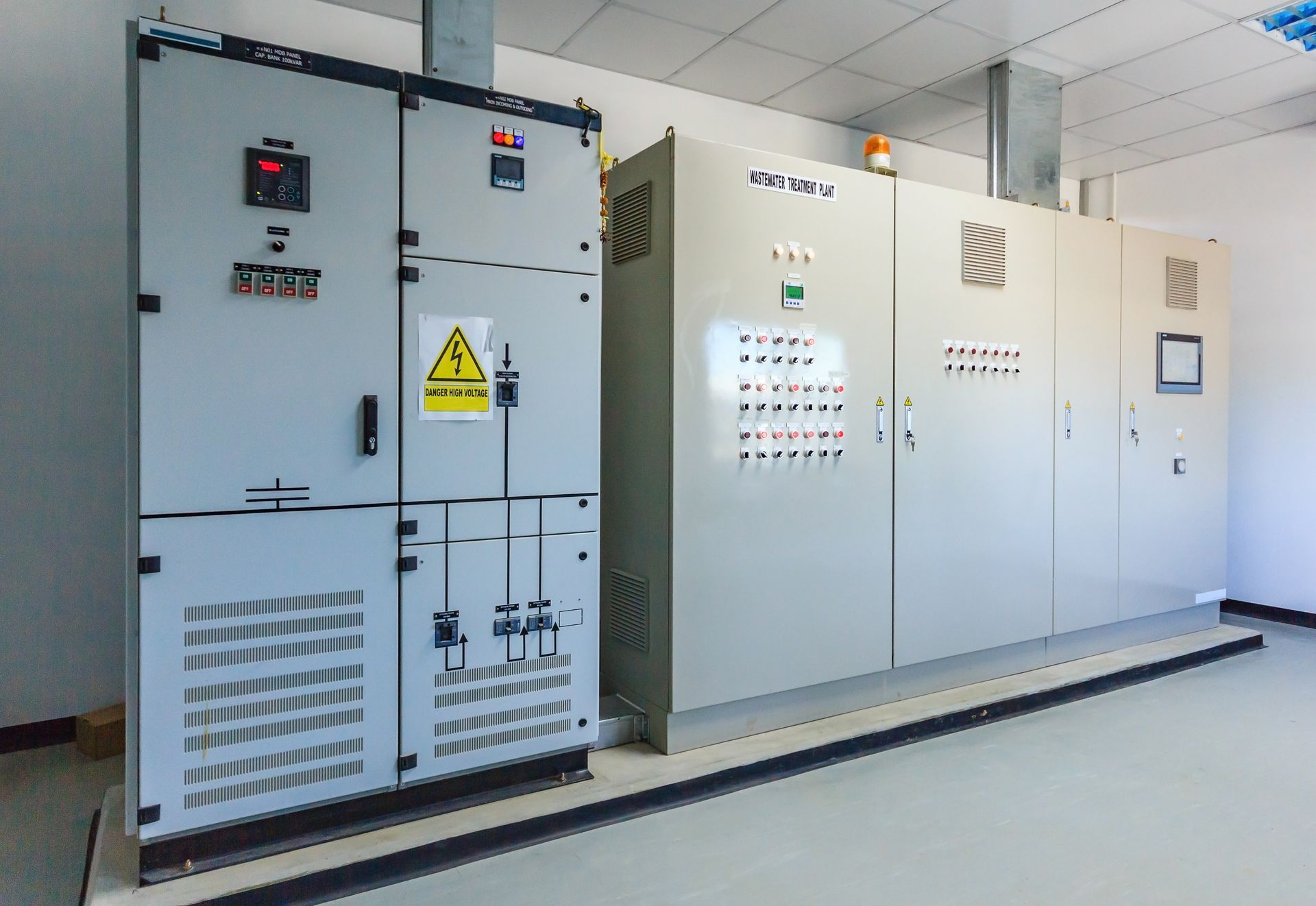 A room filled with lots of electrical cabinets and boxes.
